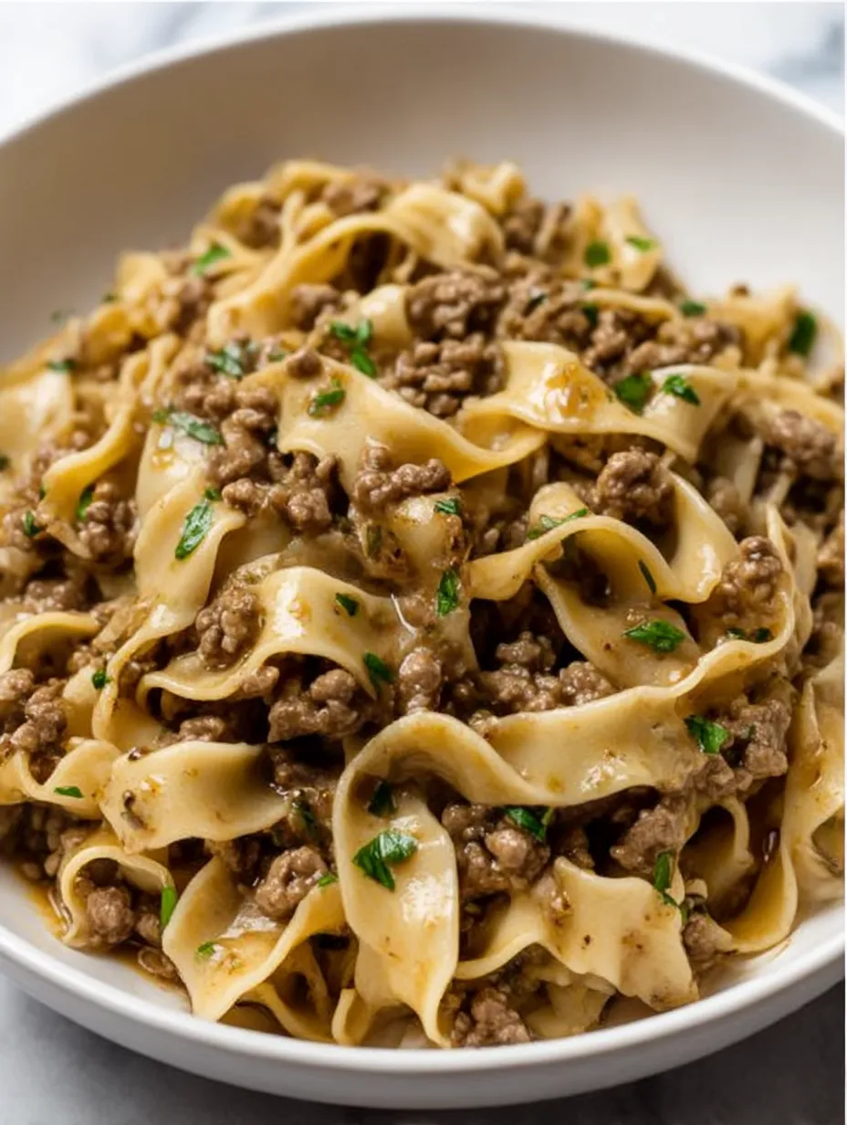 A bowl of beef and noodles.